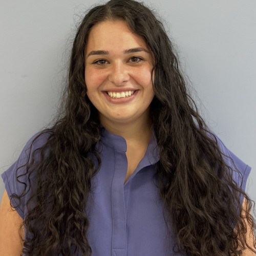woman smiling wearing a blue shirt