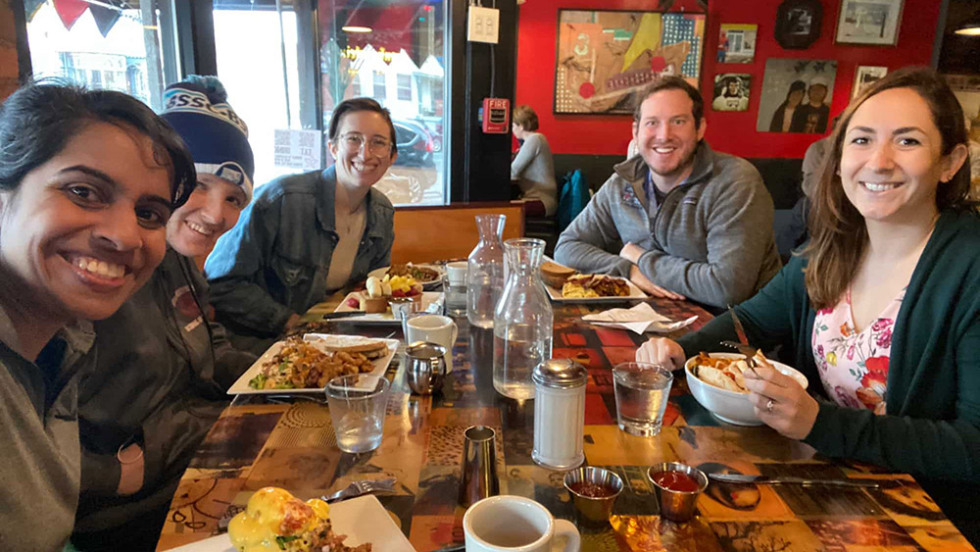 several people at a table in a restaurant